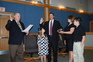 Pictured: Mayor Michael Heitzler officiates the Oath of Office for William Daniel “Danny” Wilson, Jr., surrounded by his wife Tara and children Will and Anna.