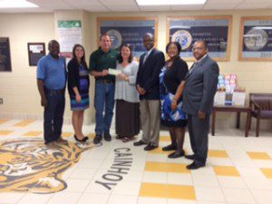 Pictured: Jane Baker (Daniel Island Fund), Giff Duaghtridge (Nucor Steel VP and General Manager), Anthony S. Dixon (Principal), Angela Prioleu (AP), Rev. Love (Community Partner), Benard Watson (Nucor/Hearts of Huger)