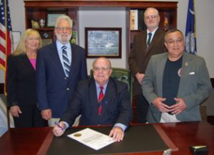 (L to R):  Cheryl Frances Ellis (Judo and Jujitsu Instructor – 2nd Degree Black Belt); Dr. Ronald Allan Charles (Senior Instructor – 8th Degree Black Belt); Mayor Michael Heitzler; Bruce Spears (Senior Jujitsu Instructor – 4th Degree Black Belt); John Merwin (Jujitsu Instructor – 3rd Degree Black Belt)