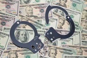 embezzle money cuffs